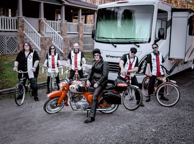 Elvis and the Outlaws sitting on their bikes